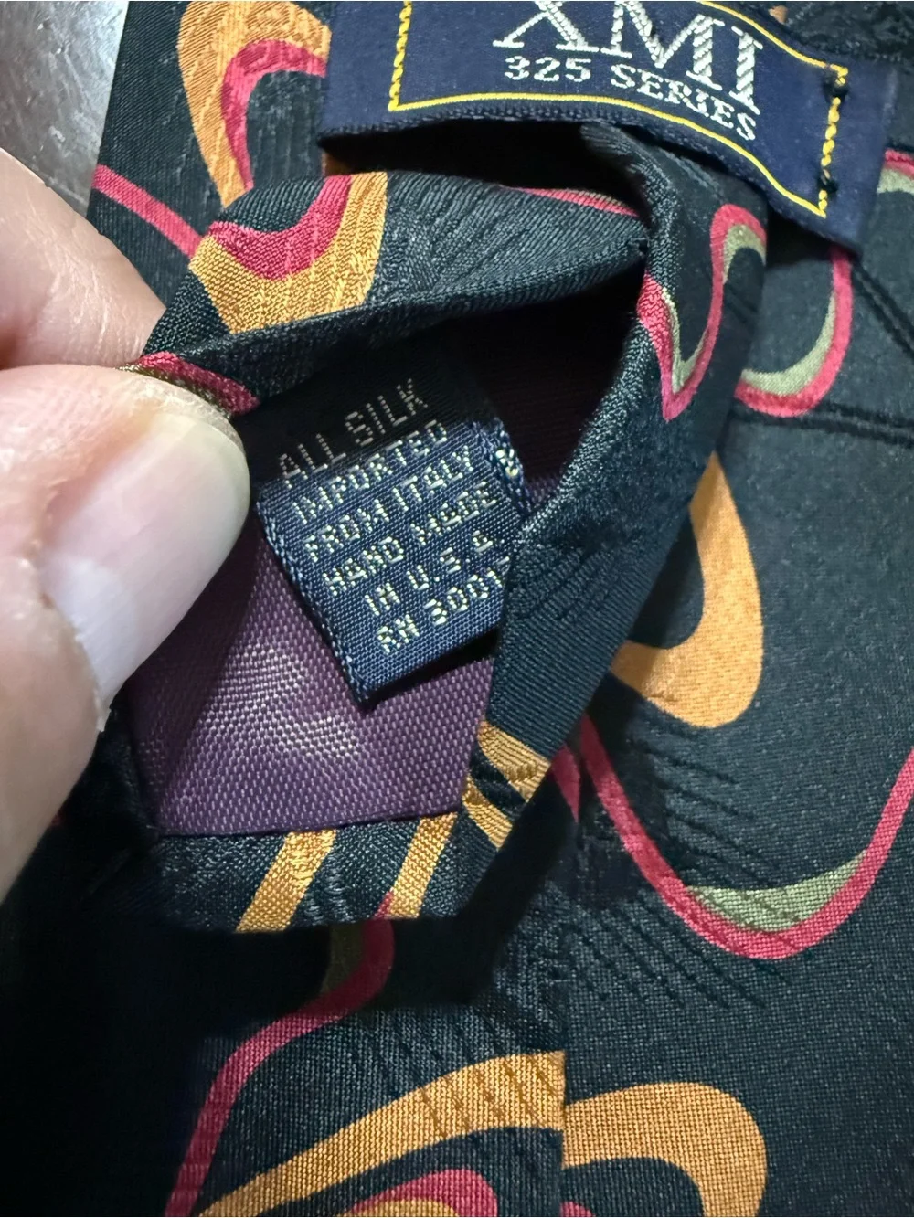 Black Tie with Orange and Pink Orbital Pattern